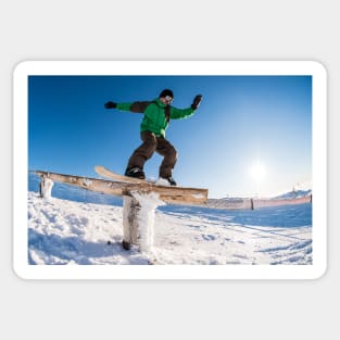 Snowboarder sliding on a rail Sticker